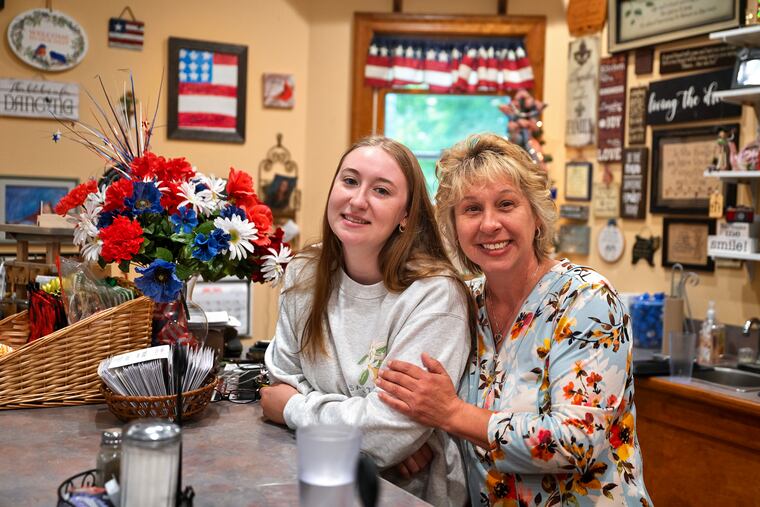 Miranda Klein (left), valedictorian of the Sullivan County High School Class of 2024, and her mother, Lyndeana Stoddard, at Pam’s Restaurant in Dushore. Stoddard would love for Klein to come home after college but isn’t sure what Sullivan County has for her.
