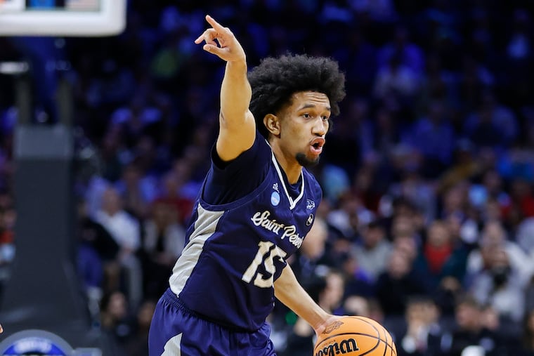 Saint Peter's guard Matthew Lee directs the offense during the NCAA East Regional Sweet 16 game against Purdue on Friday, March 25, 2022.