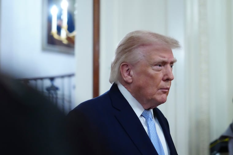 President Donald Trump arriving Friday to speak at the Commander-in-Chief's Trophy presentation with the Navy Midshipmen football team in the East Room of the White House.