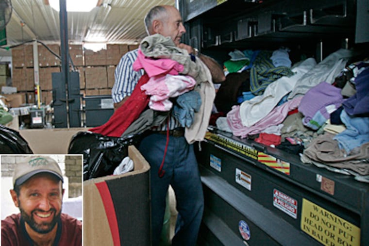 Mennonite Resource Center volunteer John Garber loads donated clothes into a baler. Glen Lapp, inset, was a Mennonite from Pennsylvania killed in Afghanistan while working as a volunteer. (Michael Bryant/Staff)
