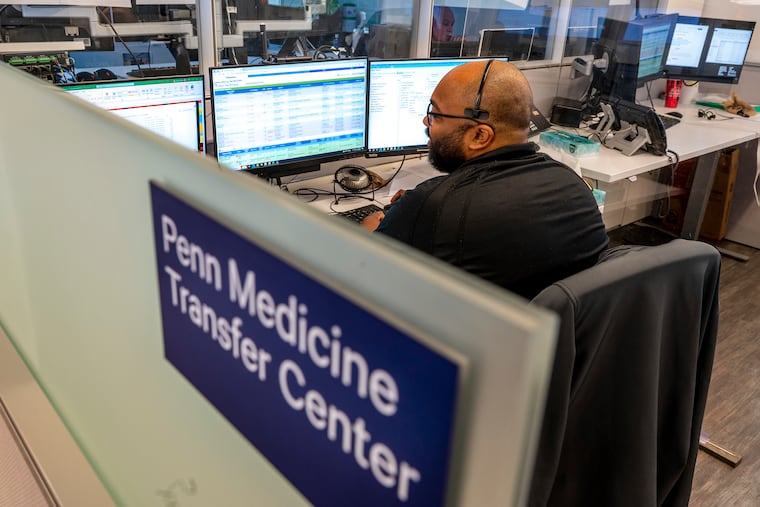 William Martin works in Penn's transfer center at the Hospital of the University of Pennsylvania Wednesday, It’s where PennSTAR medical helicopters are directed, but also where transfers of all kinds to Penn's three Philadelphia hospitals are coordinated.