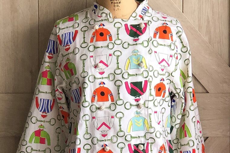 A chef's coat in the print Jockey Silks from Pomegranate Inc.