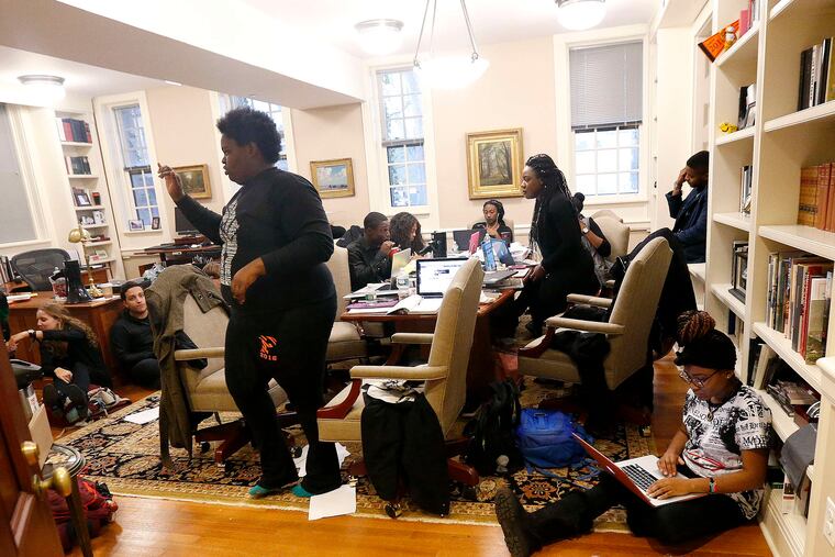 Student members of a group called the Black Justice League inside the office of Princeton University president Christopher Eisgruber. Eisgruber agreed that Woodrow Wilson, who once led the college, was racist.
