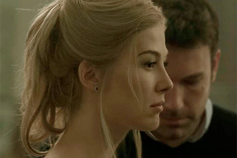 Rosamund Pike and Ben Affleck play a not-so-happy couple relocated from New York City to Missouri in "Gone Girl."