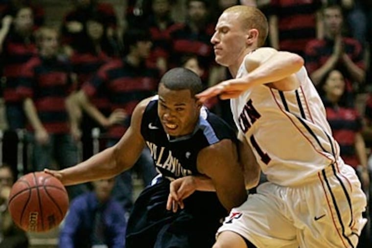 Corey Fisher (left) had four points coming off the bench in Villanova's 65-53 win over Penn. (Michael Bryant/Staff Photographer)