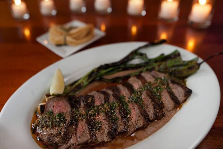 A dish for all palates: Chile-marinated flank steak, crusted with clove- and allspice-scented pasilla chiles. DAVID M WARREN / Staff Photographer