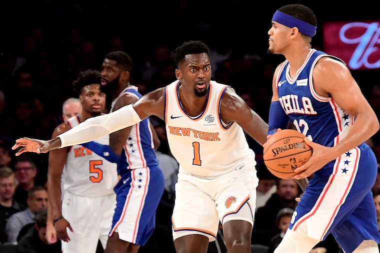 New York Knicks forward Bobby Portis (1) defends against Philadelphia 76ers forward Tobias Harris (12) during Friday's matchup at Madison Square Garden.