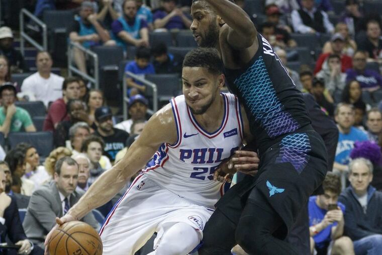 Philadelphia 76ers guard Ben Simmons, left, of Australia, drives into Charlotte Hornets forward Michael Kidd-Gilchrist in the second half of an NBA basketball game in Charlotte, N.C., Sunday, April 1, 2018. Philadelphia won 119-102.
