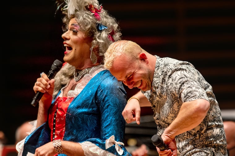 Musical director Yannick Nézet-Séguin (right) banters with local drag royalty Martha Graham Cracker during the Philadelphia Orchestra's 2022 Pride Concert at the Kimmel Center. An NEA grant toward funding this year's concert has been canceled.