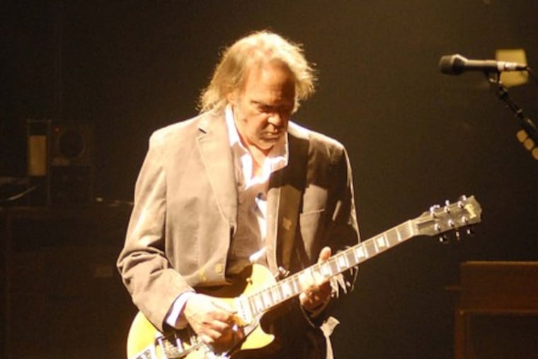Neil Young's career-spanning set at the Spectrum rocked, but also included songs of calm and beauty, such as "Old Man."