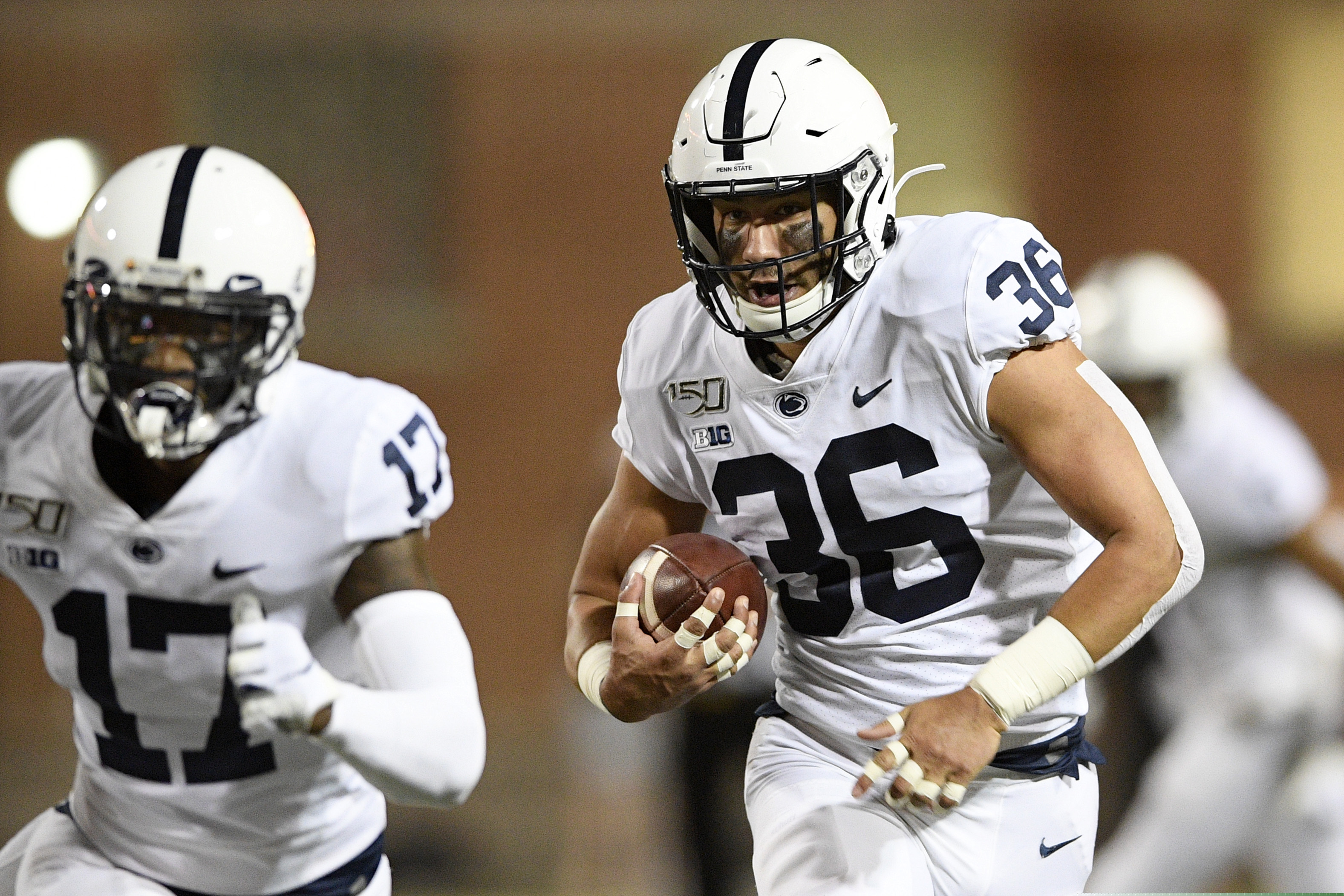 Penn State linebacker Jan Johnson (36) runs with the ball after he intercepted it during the first half of an NCAA college football game against Maryland, Friday, Sept. 27, 2019, in College Park, Md. (AP Photo/Nick Wass)