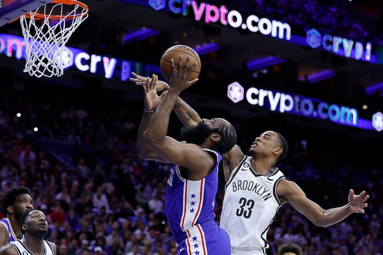 Sixers guard James Harden drives to the basket past Brooklyn Nets center Nic Claxton during in Game 2 of their first-round series.