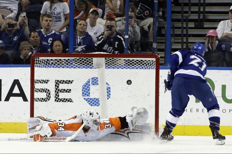 Tampa Bay’s Brayden Point beats Flyers goaltender Petr Mrazek during Saturday’s shootout. Mrazek had won eight straight shootout decisions.