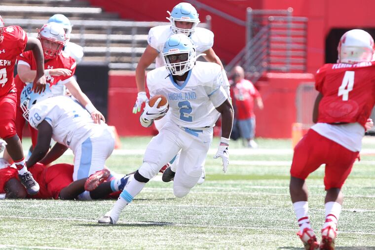 Highland's Johnny Martin carries the ball against St. Joseph in August.