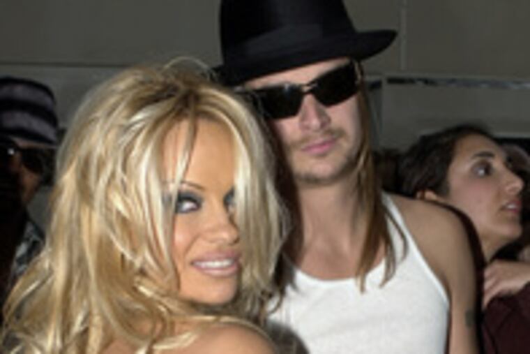 Pamela Anderson and Kid Rock at American Music Awards show in 2002.