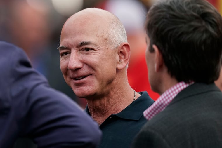 Amazon founder Jeff Bezos is seen on the sidelines before the start of an NFL football game in September in Kansas City, Mo.