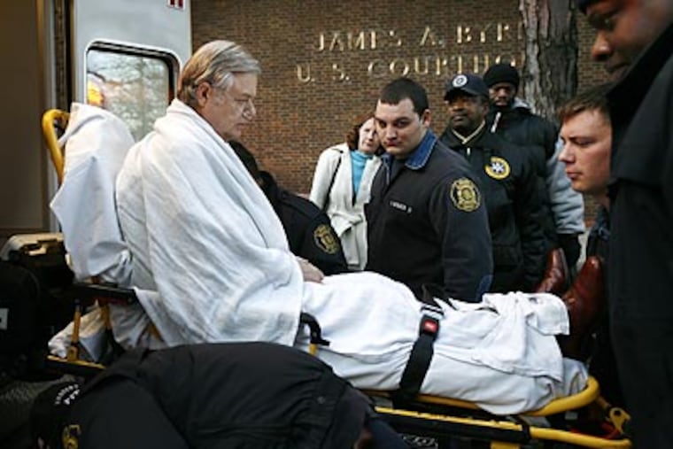 Former State Sen. Vince Fumo was wheeled out of the Federal Courthouse at 6th and Market Streets and put into an ambulance. (Eric Mencher/Staff Photographer)