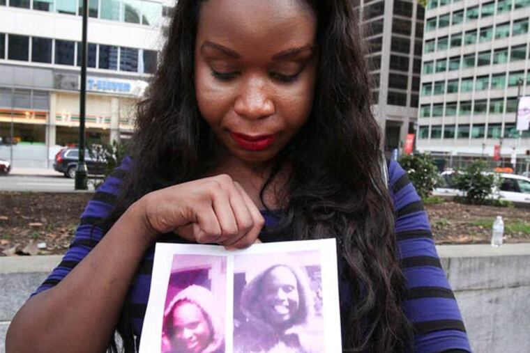 STEVEN M. FALK / STAFF PHOTOGRAPHER Aamina Morrison with a photo of her friend Diamond, a transgender woman slain in July.