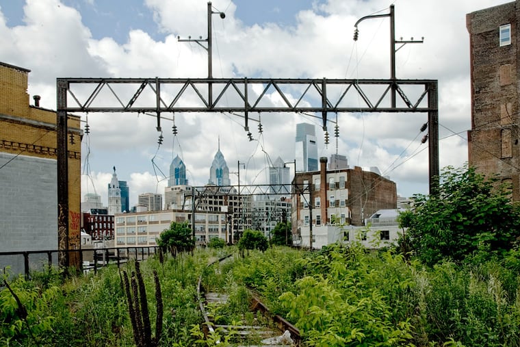 The Philadelphia city skyline as viewed from the Reading Viaduct, envisioned as a part of future park.
