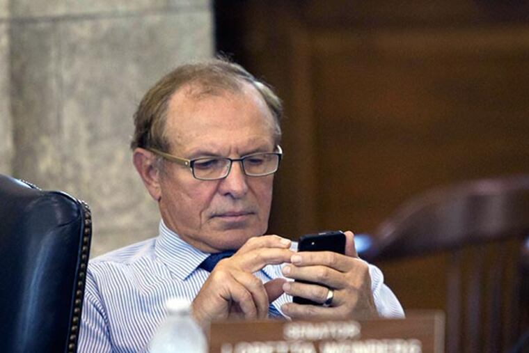 Senate Judiciary Committee member Senator Raymond J. Lesniak checks messages before interviewing state Supreme Court nominee Camden County Assignment Judge Faustino Fernández-Vina. Photo taken in Committee Room 4, State House Annex, Trenton, October 17, 2013. ( DAVID M WARREN / Staff Photographer )