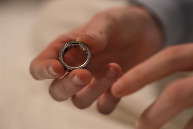 Middle school teacher Kate Stoye puts on an Oura Ring. The wearable device tracks sleep architecture, heart rate variability, and cycle-linked physiologic changes in real time across millions of users across the world, writes Priya E. Mammen.