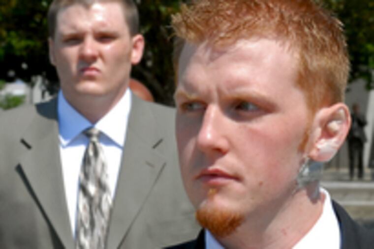 Britt Reid (right) and his brother, Garrett Reid, leave the Montgomery County Courthouse. The sons of Eagles coach Andy Reid face drug and traffic charges, and Britt Reid faces a weapons charge.