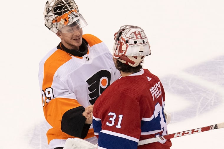 Canadiens goaltender Carey Price (right) congratulates Flyers goaltender Carter Hart after the Flyers beat the Canadiens, 3-2, on Friday night.
