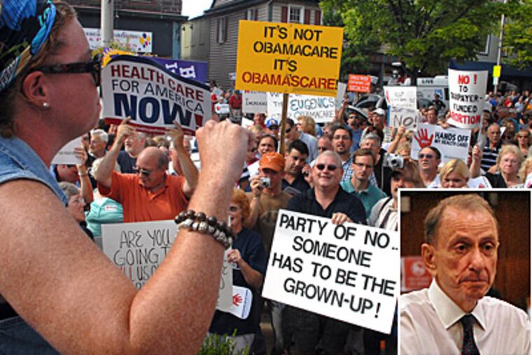 Angry crowds inside and out greeted Sen. Arlen Specter at a town hall meeting on health care reform in Lebanon. (Tom Gralish / Staff)