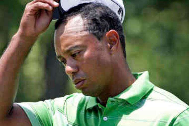 Tiger Woods shot a 70 Friday in the AT&T National for a two-round total of 143, barely making the cut.