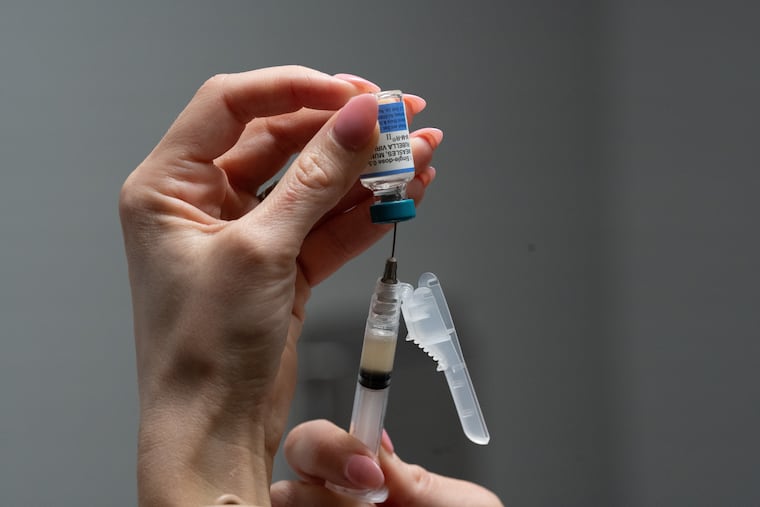 Lauren Ellenburg, a nurse, prepares a combination measles, mumps, and rubella vaccine for a patient at Tiger Pediatrics in Easley, S.C., March 17, 2026. (AP Photo/Mary Conlon, File)