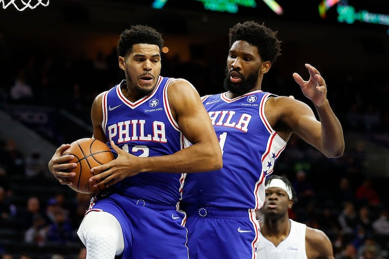 Philadelphia 76ers forward Tobias Harris (12) and Joel Embiid both had COVID-19. Both felt the effects long after they returned.