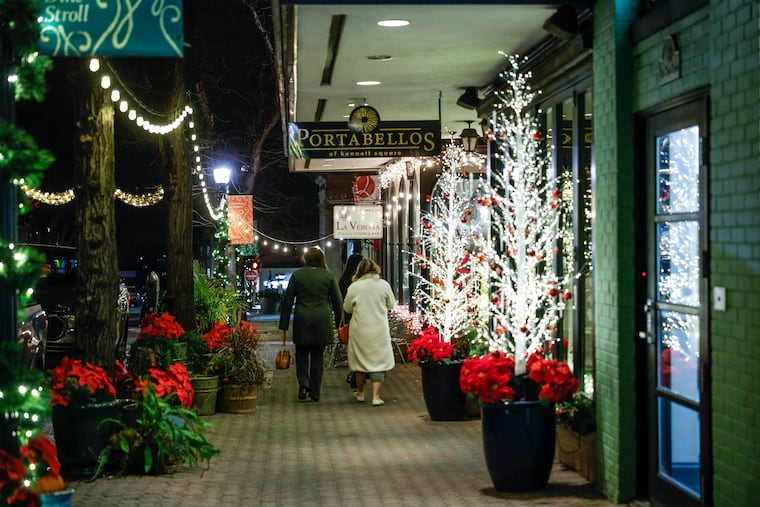 State Street in Kennett Square is lit for the holiday season Friday, in sync with one of its biggest sources of business, Longwood Gardens.