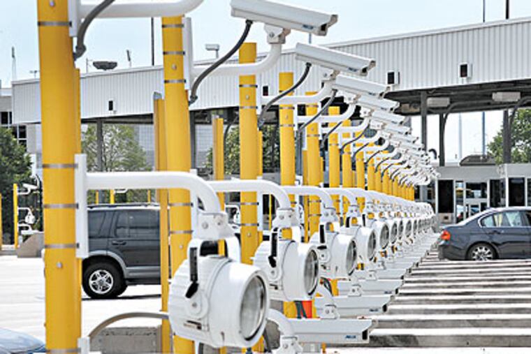 Cameras were installed at Philadelphia International Airport to take photograph license plates as automobiles enter the parking garage and again when they leave. These are at the toll booth exits. (Sharon Gekoski-Kimmel / Staff Photographer)
