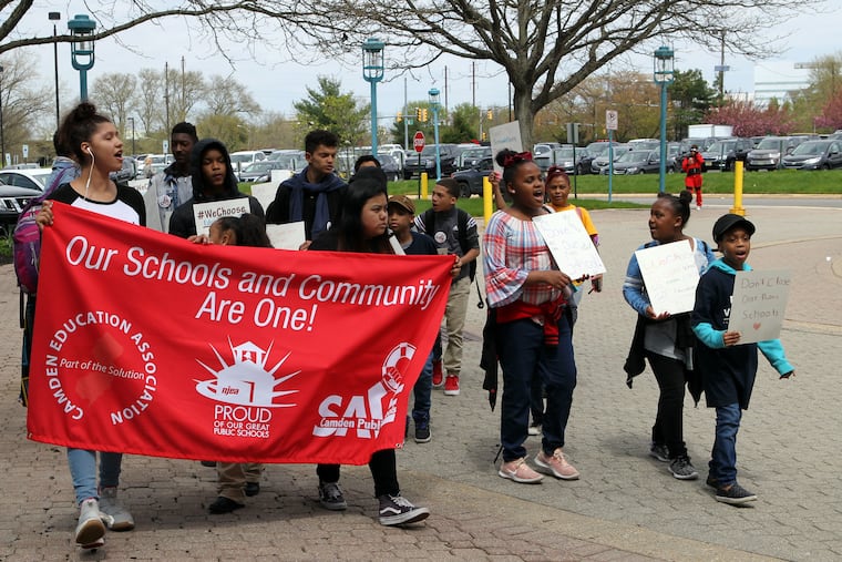Protestors led by Gary Frazier from Save Camden Public Schools march outside a meeting of the New Jersey Board of Education last month.
