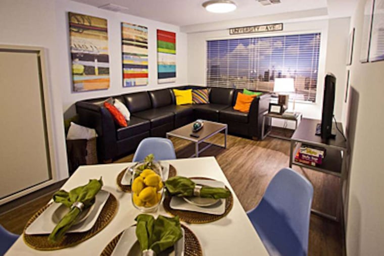 Living room and dining area of a model double-bedroom unit in Chestnut Square dorm at Drexel