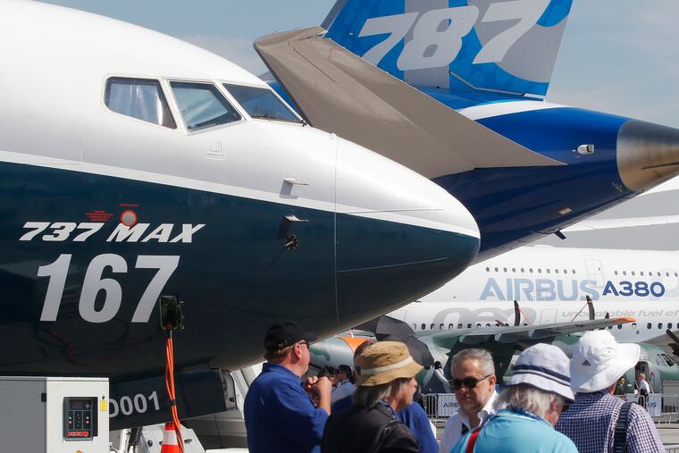 FILE - In this June 20, 2017, file photo Boeing planes displayed at Paris Air Show, in Le Bourget, east of Paris, France. Uncertainty over a Boeing jet and apprehension about the global economy hover over the aircraft industry as it prepares for next week's Paris Air Show. (AP Photo/Michel Euler, File)