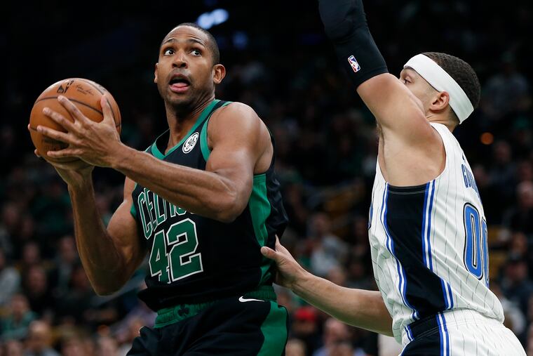 Al Horford shoots over the Magic's Aaron Gordon.