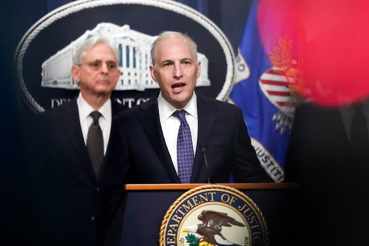 Justice Department's Assistant Attorney General for the National Security Division Matthew Olsenspeaks during a news conference at the Department of Justice in Washington in January as Attorney General Merrick Garlandlistens at left.
