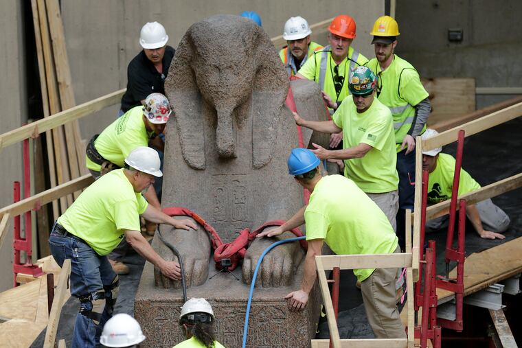Workers slowly move the 25,000 pound Sphinx of the Pharaoh Ramses II at the Penn Museum to its new location inside the museum in Philadelphia, PA on June 12, 2019.