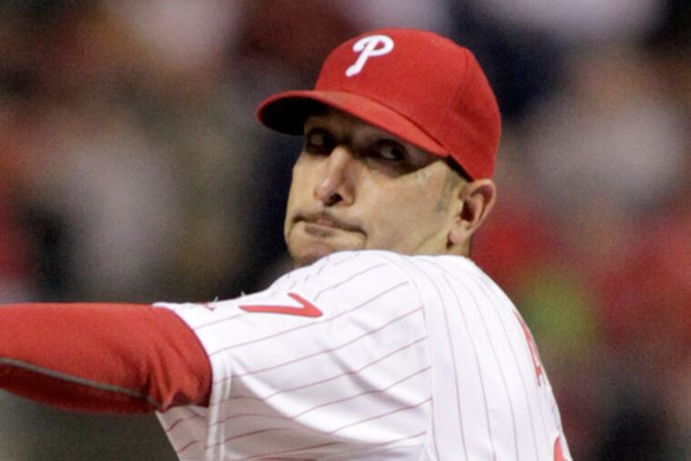 Mike Adams throws against the Miami Marlins in the eight inning of a baseball game on Thursday, May 2, 2013, in Philadelphia. The Phillies won 7-2. (H. Rumph Jr/AP)
