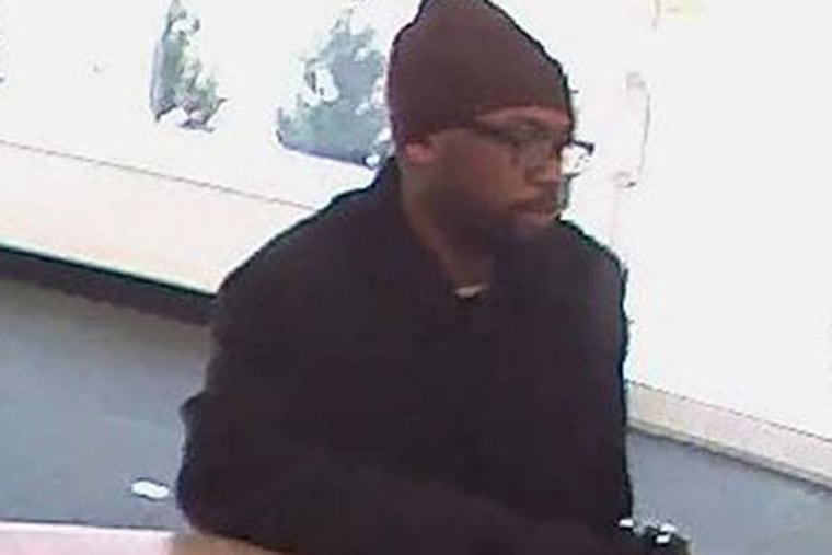 Suspected serial bank robber Tarik Hooks hit the TD Bank on Ridge Avenue on Feb. 14, 2013. Three days later, cops say the same guy returned to the same branch for another try.