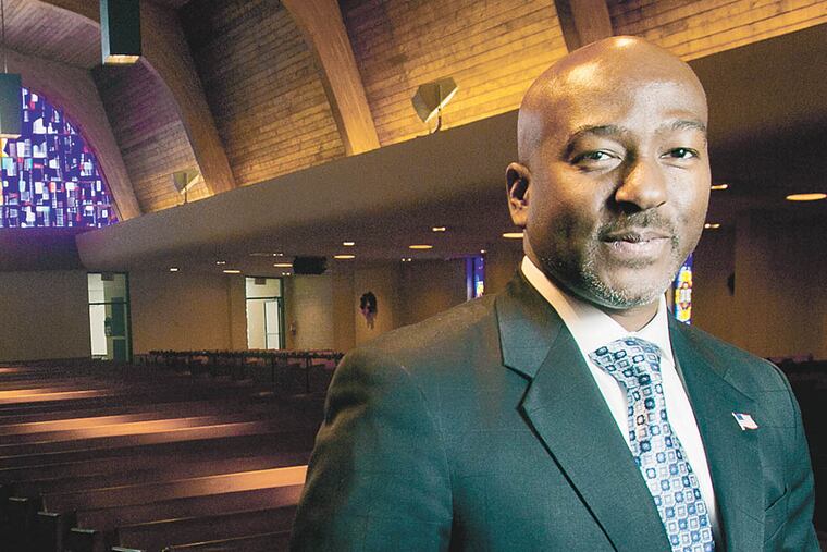 Rev Kevin Johnson, pastor of Bright Hope Baptist Church at N. 12th and Cecil B. Moore traveled to Sierra Leone, to build a church. Photograph taken in sanctuary of of Bright Hope Baptist on Tuesday morning December 10, 2013. ( ALEJANDRO A. ALVAREZ / STAFF PHOTOGRAPHER )