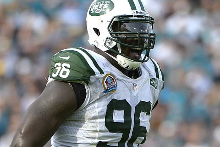 New York Jets defensive end Muhammad Wilkerson (96) celebrates after sacking Jacksonville Jaguars quarterback Chad Henne during the second half of an NFL football game in Jacksonville, Fla., Sunday, Dec. 9, 2012.(Phelan M. Ebenhack/AP)