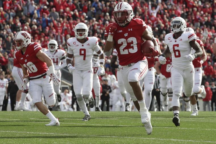 Wisconsin's Jonathan Taylor runs for a touchdown during the second half of an NCAA college football game against Rutgers Saturday, Nov. 3, 2018, in Madison, Wis.