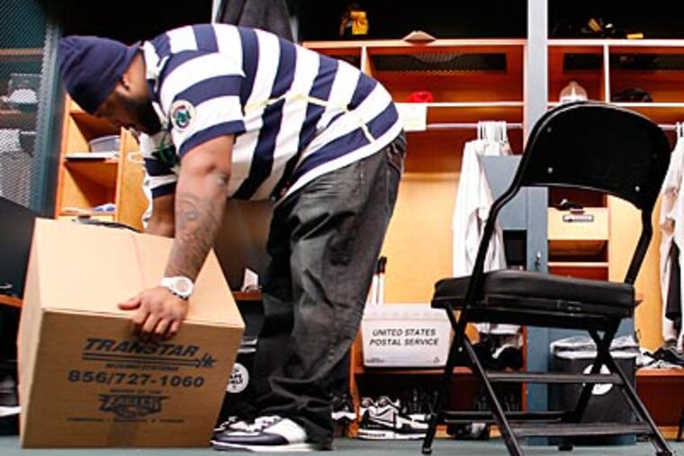 Nick Cole packs a box at the NovaCare Complex the day after the Eagles season ended. (David Maialetti/Staff Photographer )
