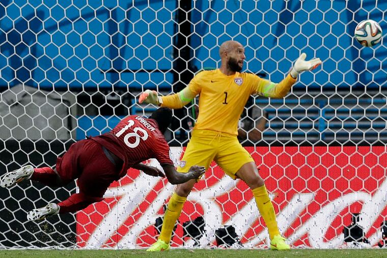 Portuguese man o' score: Silvestre Varela heads a crossing pass from Cristiano Ronaldo past Tim Howard in the final seconds of stoppage time - the latest regulation goal in World Cup group-stage history. Team USA had to settle for a tie instead of a dream victory.