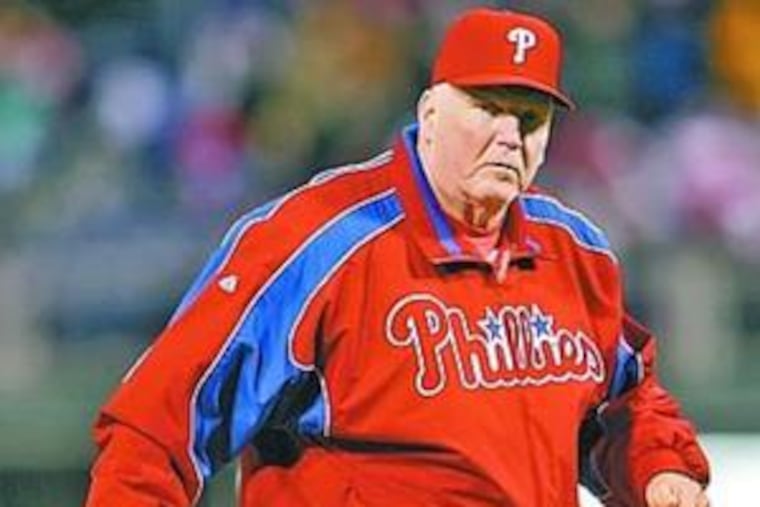 Charlie Manuel walks back to dugout after pitching change in fifth inning.