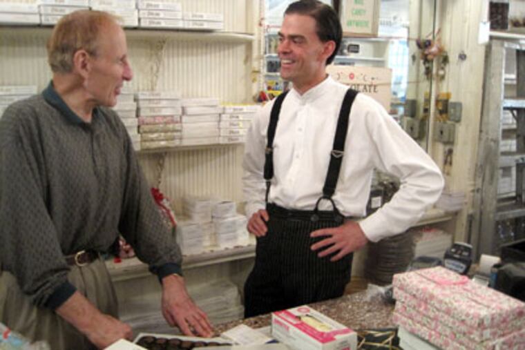 Barry Shane (left) chats with new owner of Shane Candy, Ryan Berley. (Rick Nichols / Staff)