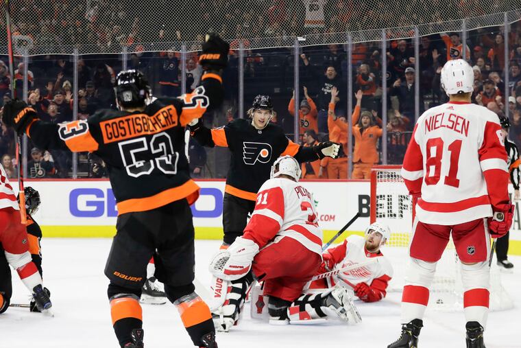 Flyers defenseman Shayne Gostisbehere celebrates his first-period goal in Friday's 6-1 win over Detroit at the Wells Fargo Center.