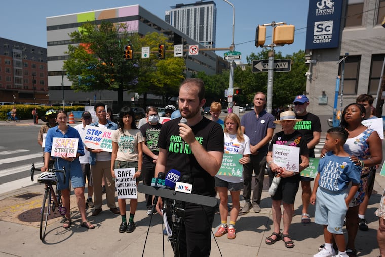 Gabriel Straus, who serves as vice chairperson and a board member for Philly Bike Action, speaks at a rally to advocate for safer bike infrastructure at 34th and Market Streets.